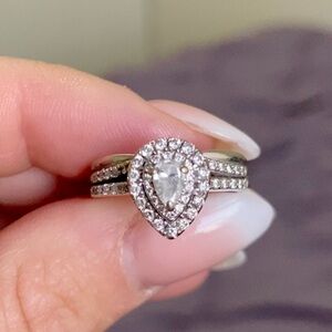 White gold pear shaped engagement ring and wedding band set.